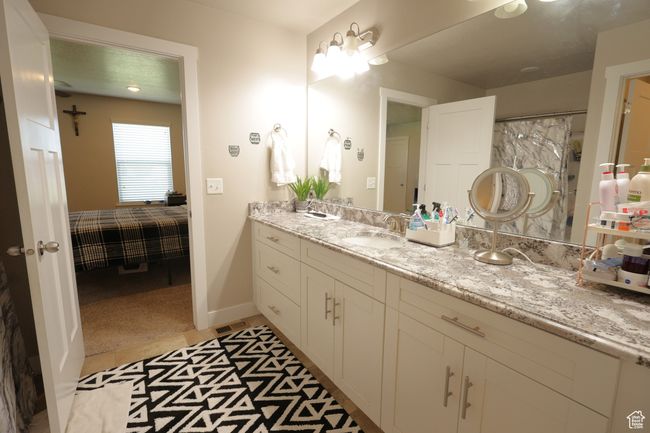 Ensuite bathroom with light tile patterned floors and vanity | Image 6