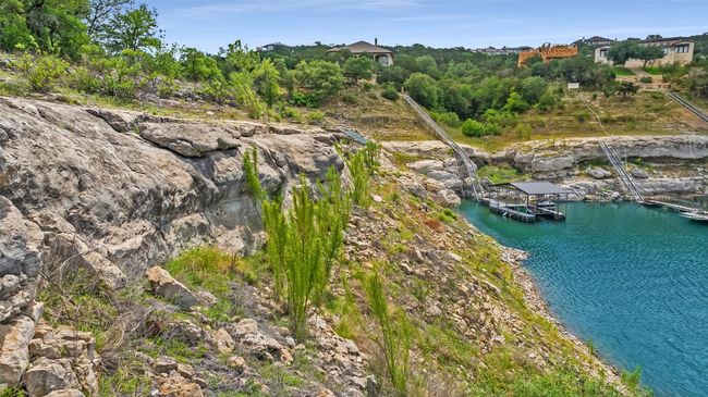 The topography is a striking mix of gently sloping build sites and dramatic limestone cliffs. | Image 15