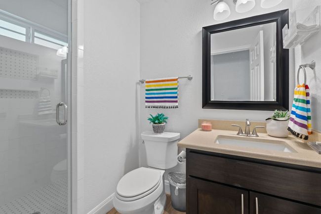 Bathroom with vanity and a shower stall | Image 13