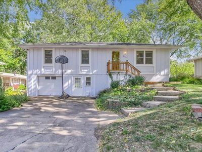 View of front facade with a garage | Image 1