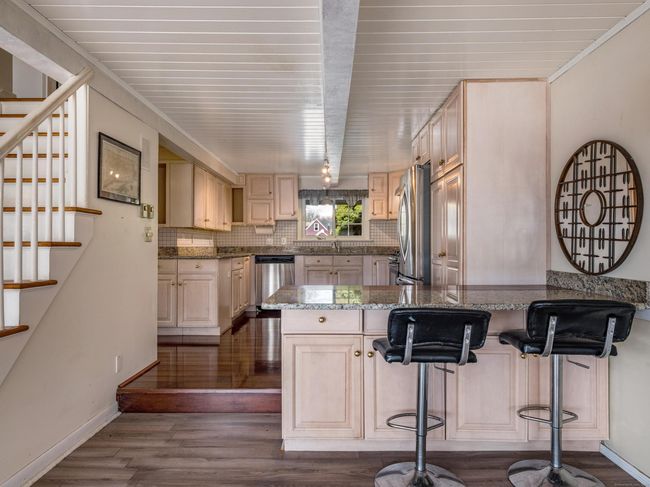 Bar seating area for additional counter and prep space. | Image 11