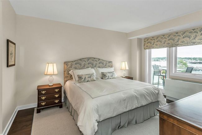 Bedroom with light wood-type flooring, baseboards, and access to outside | Image 10