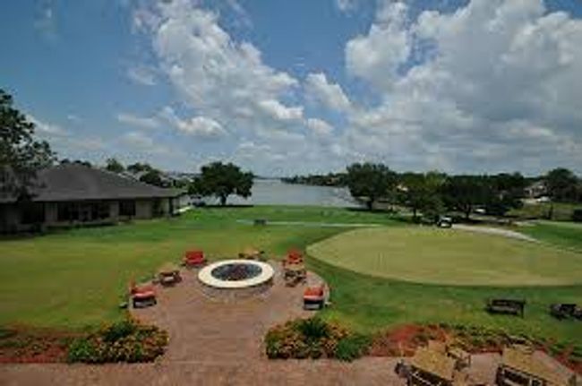 Surrounding community with a water view and a lawn | Image 17