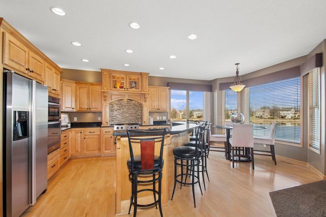 Kitchen with island seating | Image 10
