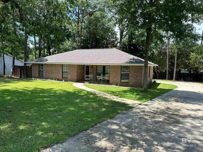 Single story home featuring a front lawn | Image 1