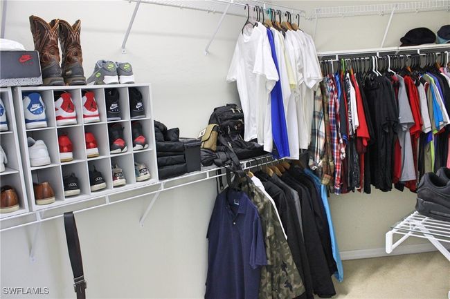Walk in closet with carpet flooring | Image 18