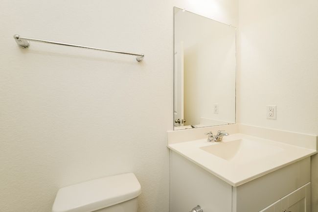 Bathroom featuring vanity and toilet | Image 20