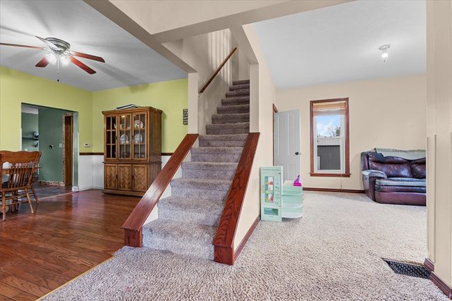 Semi-open staircase leading upstairs is between th | Image 20