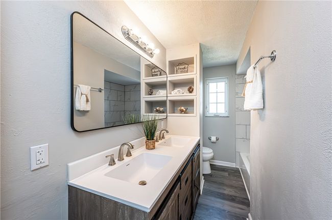 WOW! Check out this awesome new main bathroom with a spacious double vanity & built in shelves. | Image 18