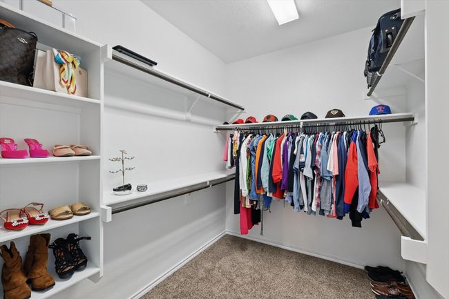 Walk in closet featuring carpet flooring | Image 21