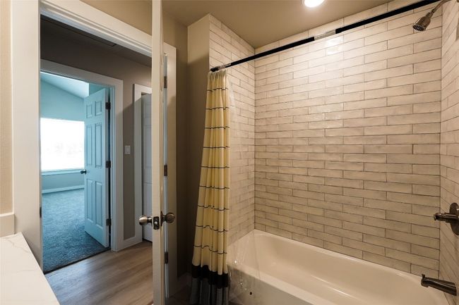 Full bathroom with shower / bath combo and wood finished floors | Image 20
