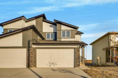 345 Dawson Wharf Rd, Home with 4 bedrooms, 3 bathrooms and 4 parking in Chestermere AB | Card Image