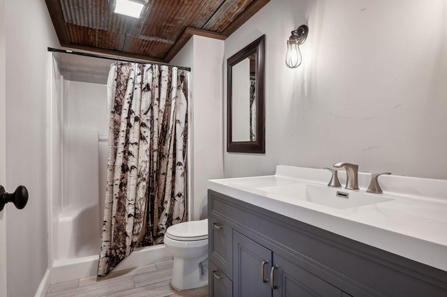 There is a den which is ideal for a 2nd home office or gaming | Image 26