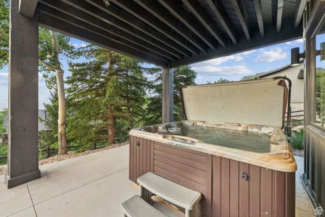 View of patio featuring a hot tub | Image 56