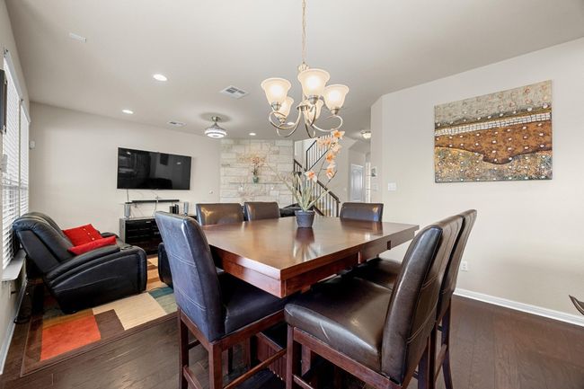 the dining area sits between the living room and kitchen making it easy to serve up meals and stay in the conversation while working in the kitchen. | Image 13