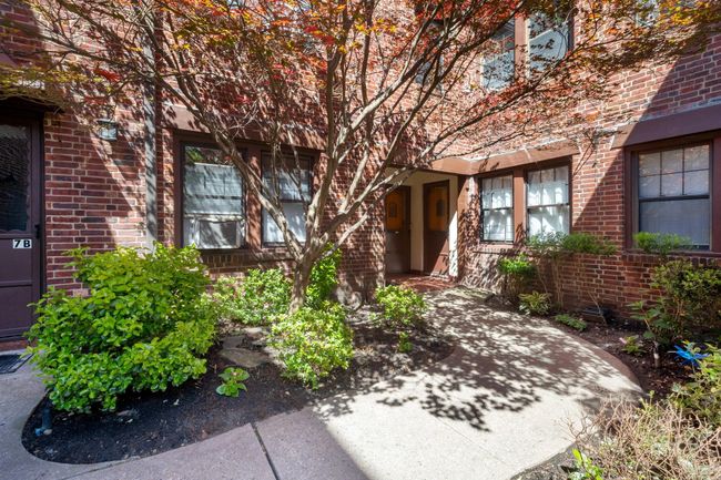 Doorway to property featuring brick siding | Image 9