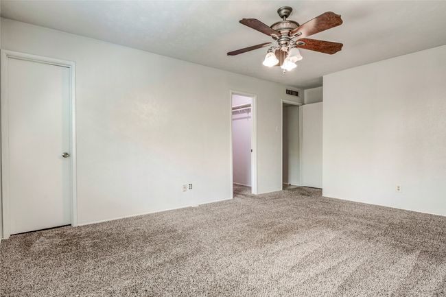 Carpeted empty room with a ceiling fan | Image 22