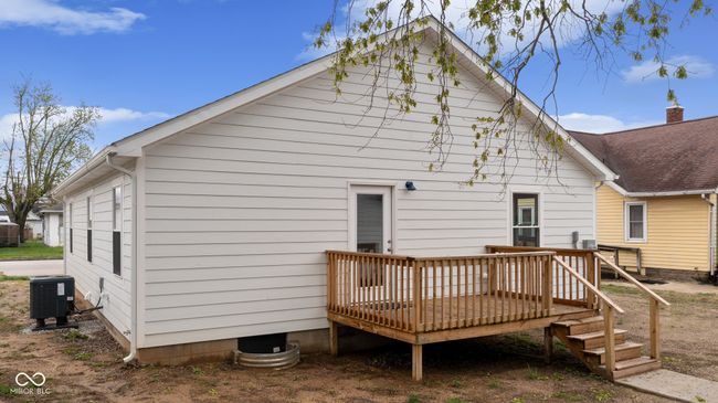 rear view of house featuring central AC and a deck | Image 8
