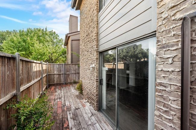Wooden deck featuring a fenced backyard | Image 17