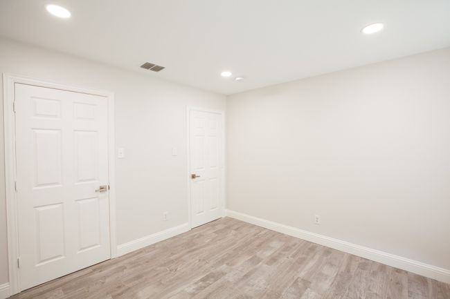 Spare room with light wood finished floors and recessed lighting | Image 25