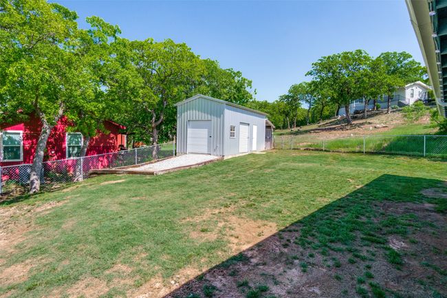 Spacious fenced backyard and shop | Image 32