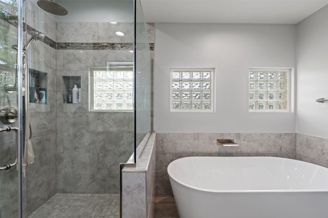 Full bath with a freestanding tub and a shower stall | Image 21
