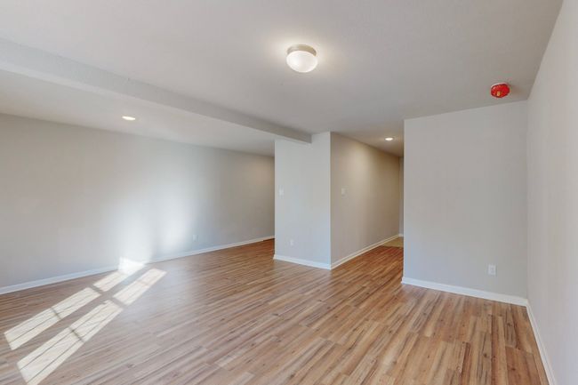 Unfurnished room with light hardwood / wood-style flooring | Image 9
