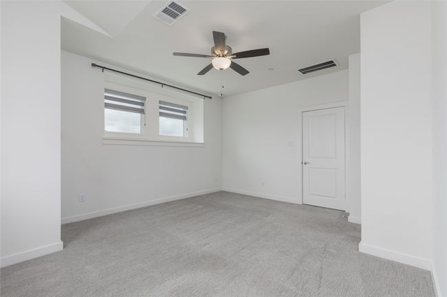 Spare room with light carpet and a ceiling fan | Image 16