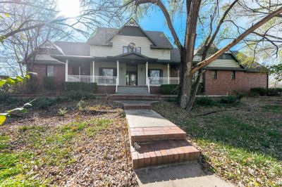 View of front of home with covered porch | Image 1