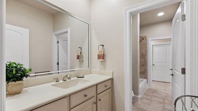 View of Jack and Jill bath from the opposite bedroom. It has a tub and shower combination. | Image 38