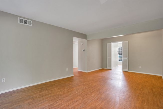 Empty room featuring light flooring | Image 7