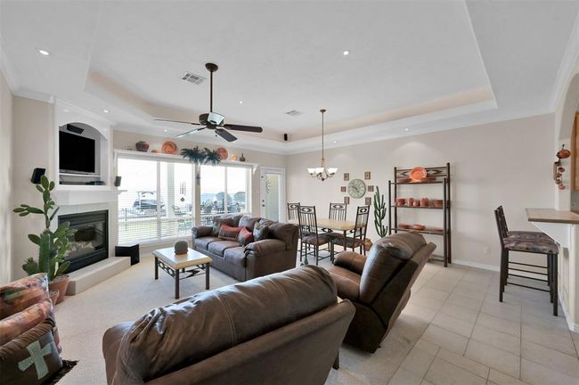 Open living / dining with gaslog fireplace and breathtaking views. | Image 6