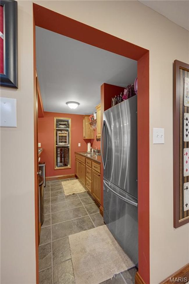 Kitchen with freestanding refrigerator and a sink | Image 59