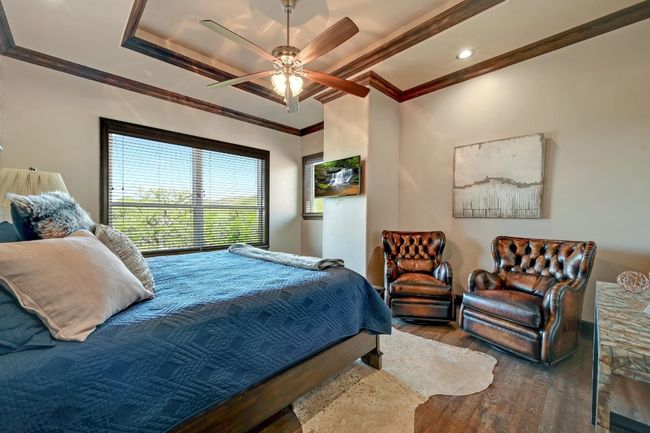 Bedroom featuring ornamental molding, ceiling fan, recessed lighting, and wood finished floors | Image 32