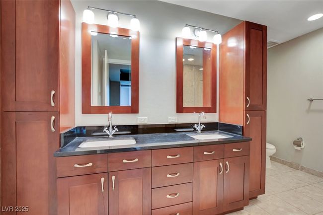 Primary Bathroom with tile patterned flooring, a sink, double vanity, and toilet | Image 22