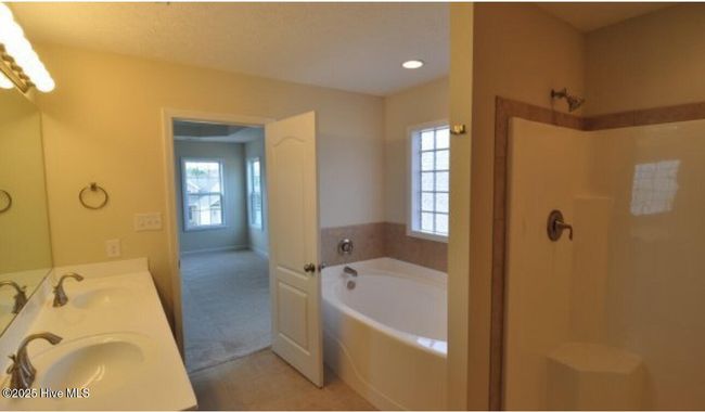 Double vanity, walk-in shower, and large tub | Image 19