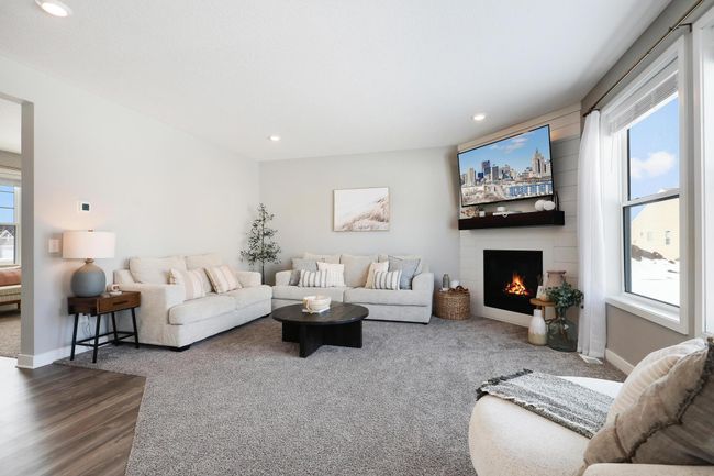 Great room with shiplap corner fireplace | Image 22