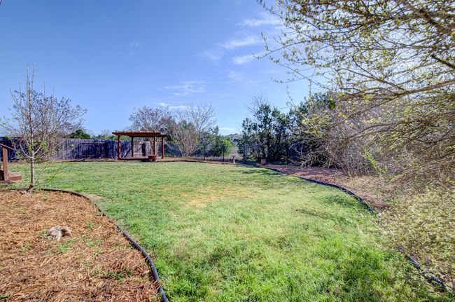 View of yard with a fenced backyard | Image 29