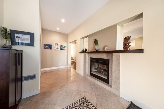 Hall featuring baseboards, tile patterned flooring, recessed lighting, and stairway | Image 17