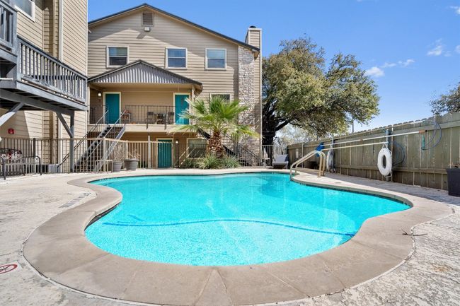 The community pool provides a refreshing retreat, offering a perfect spot to relax and soak up the sun. | Image 27