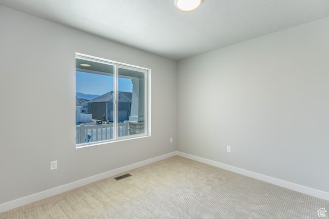 Carpeted empty room featuring baseboards | Image 23