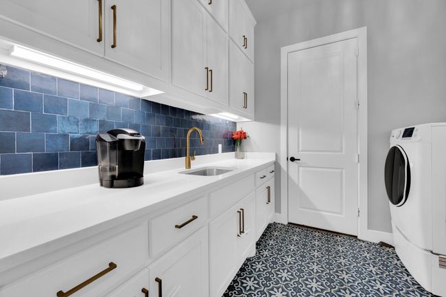 Laundry room featuring washer / clothes dryer and cabinet space | Image 35