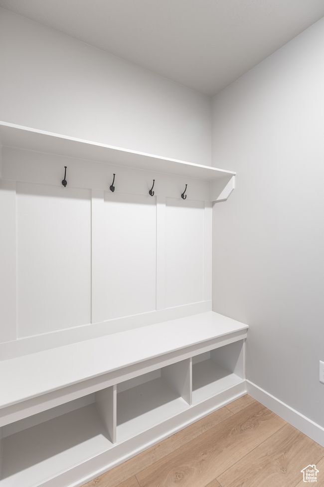 Mudroom with light wood-style floors and baseboards | Image 20