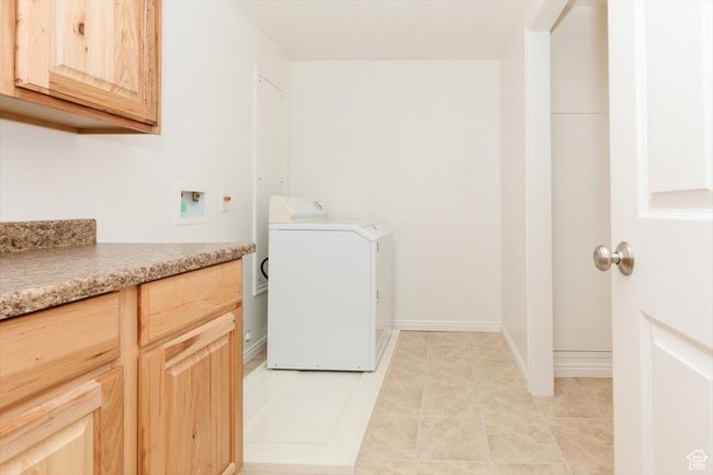 Washroom with washer / dryer and cabinet space | Image 53