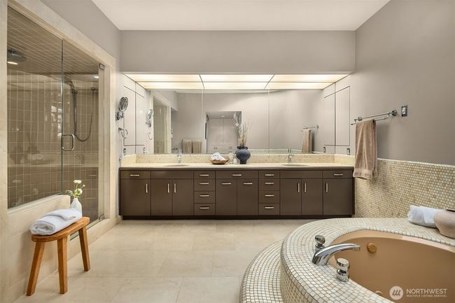 Spa bathroom with shower, deep soaking tub, and dual sink vanity. | Image 22