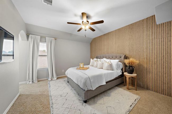 This secondary bedroom may be one of the best rooms. This room features a custom wall that has a hidden gem on the other side. Dedicate bathroom plus walk in closet. | Image 22