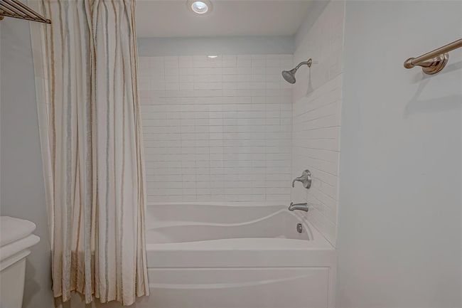 Experience ultimate relaxation with the convenient bathtub and shower combo in the master bathroom. | Image 13