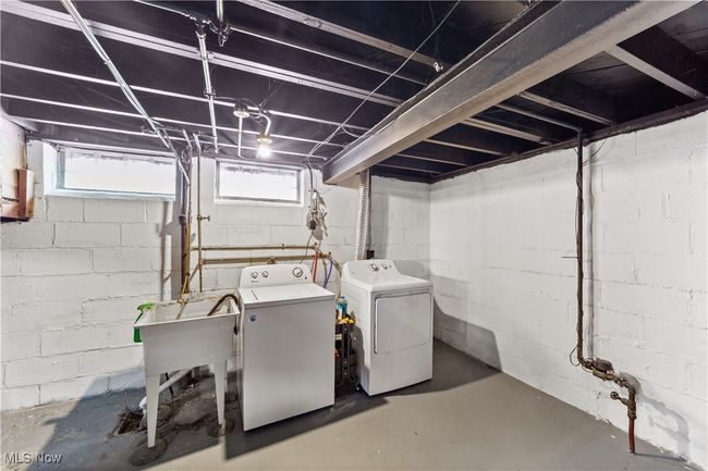 Below grade area featuring washing machine and clothes dryer | Image 27