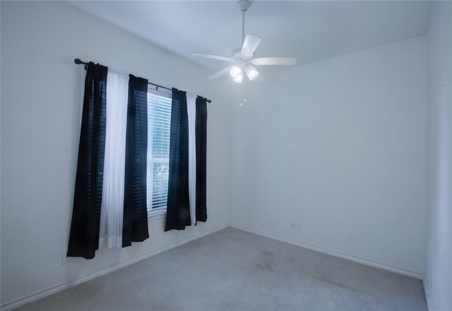 Carpeted spare room with a ceiling fan and baseboards | Image 16