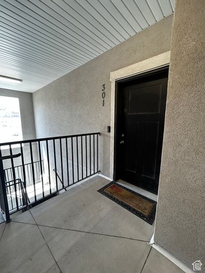 Doorway to property with a balcony | Image 2